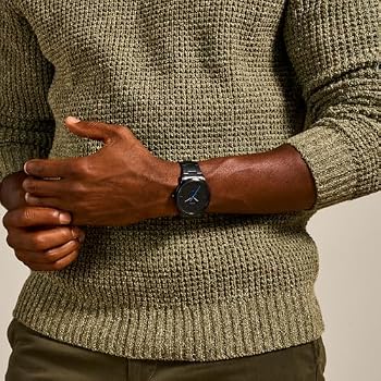 A man wearing micheal kors watch